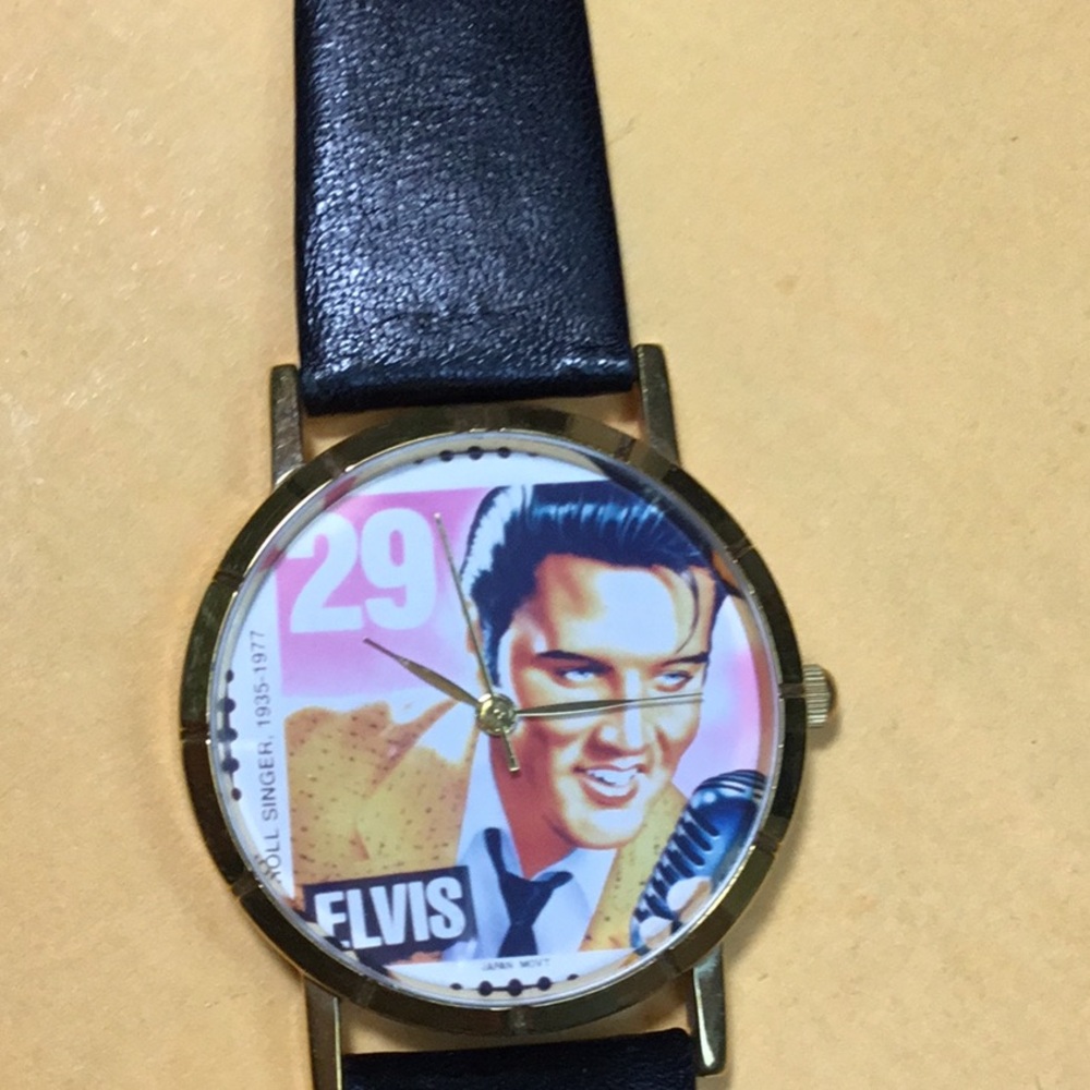 Black and Gold Collector's Watch with Decorative Face